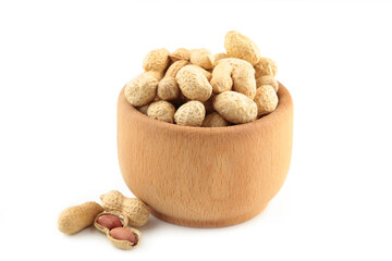Dried peanuts in wooden bowl isolated on white background.