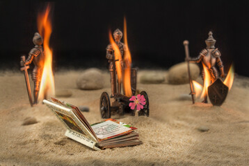 Brennende Spielzeug Soldaten mit einem Buch im Vordergrund