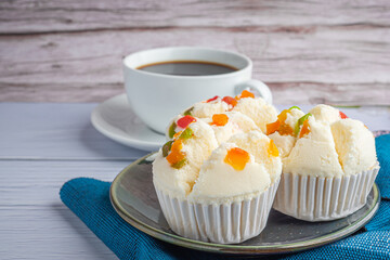 Thai steamed cupcakes topped with dry fruit on plate