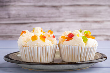 Thai steamed cupcakes topped with dry fruit on plate