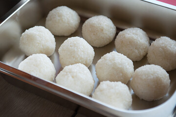 Fototapeta na wymiar Rice balls in an iron bowl for making sushi and rolls.