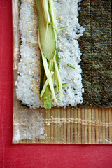 Sushi blanks with cucumber and sesame seeds top view.