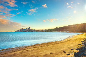 Talamone beach and village at sunset. Maremma, Tuscany, Italy