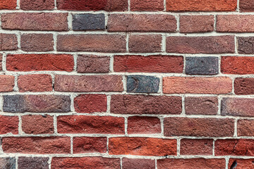 Obraz premium Very original solid stable brick wall as a background or texture. Unique masonry and color