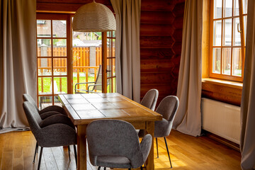 Interior of dining room in wooden house