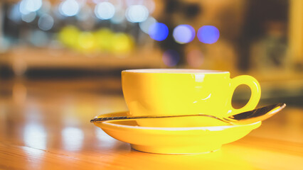 A cup of coffee with milk in a coffee shop