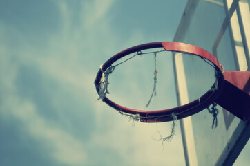 Fototapeta na wymiar old basketball hoop against the sky