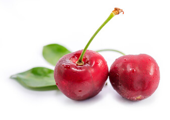 red cherries with leaf isolated on white background