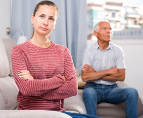 Home quarrel adult daughter and elderly father. High quality photo
