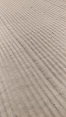 Sand on the beach after being smoothed out