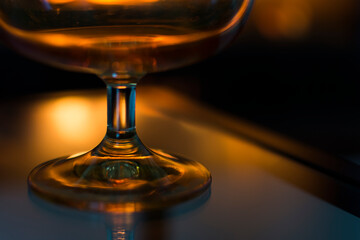 Glass of wine in front of a hot fireplace.