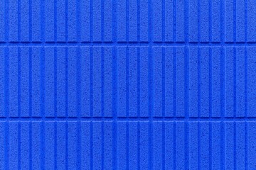 Fototapeta premium Modern blue stone wall with stripes texture and seamless background