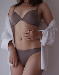 woman body in lingerie on green background