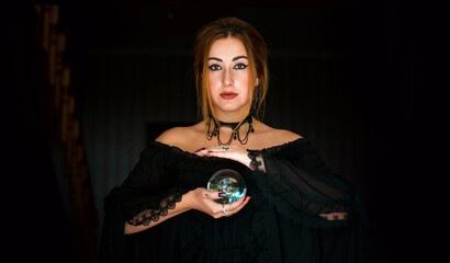 Woman fortune teller on a crystal ball, Concept of predictions, magic rituals and wicca