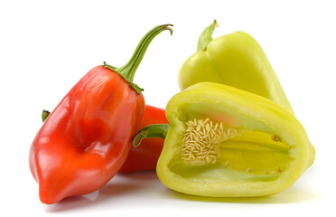 bell pepper whole and halves, close-up on a white isolated background, space for text, horizontal view