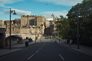 Fototapeta na wymiar Summer view of Waverley Bridge and buildings of Edinburgh Old Town. Edinburgh Scotland UK. Now this road is closed. 20 JULY, 2020