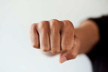 man throwing a punch or fist bumping
