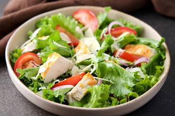 Chicken salad with tomatoes and parmesan cheese