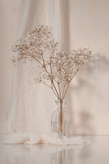 Flowers a glass vase with a decorative pink background