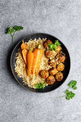 Quinoa with vegetable balls and baked carrots. Vegetarian healthy balance nutrition