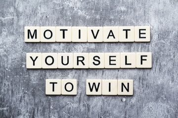 Motivational phrase Motivate yourself formed with plastic letters