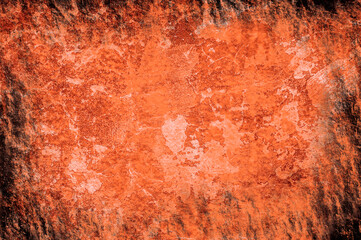 Bright orange texture similar to burnt paper or rusty surface