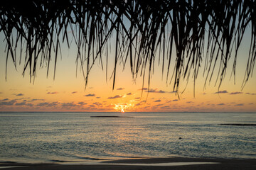 beach hut sunset