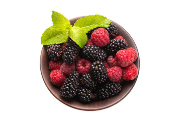 Raspberry, blackberry and mint leaf in ceramic brown bowl isolated on white