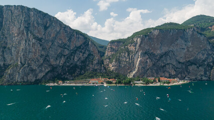 Kitesurfing in front of mountains on the lake