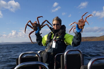 Senior staying active - king crab fishing in Norway