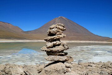 Stone Stack Made by Travelers on the Shore of Laguna Verde or the Green Lake with Lincancabur Volcano in the Backdrop, Eduardo Avaroa Andean Fauna National Reserve in Bolivia, South America