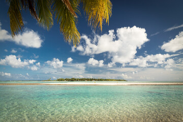 tropical island with blue sky and clouds