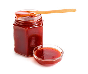Jar and bowl of tasty strawberry jam on white background
