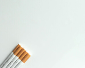 stack of cigarette on white background from top view.