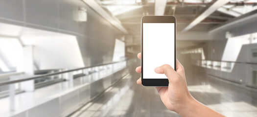 Hand holding smartphone device and touching screen