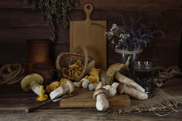 Fresh forest mushrooms on a wooden table.