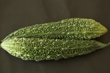 bitter gourd in a black back ground