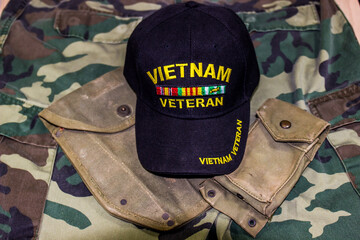 Vietnam Veteran Hat & Pouches On Camoulage Uniform