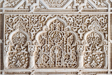 Ancient arabic ornaments on the wall of Alhambra, Granada, Spain