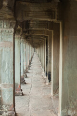 Fototapeta na wymiar The temple complex of Angkor Watt, Cambodia, passageway with repeating arches