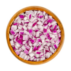 Diced red onions in wooden bowl. Cut cubes of onion cultivar Allium cepa, with purplish red skin...