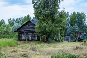 Old wooden house. Abandoned, lonely peasant house.