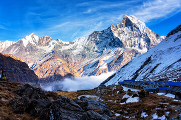 Panorama of Mount Machapuchare (Fishtail) at sunset, view from Annapurna base camp in the Nepal Himalaya. Machhapuchchare is a mountain in the Annapurna Himal of north Central Nepal