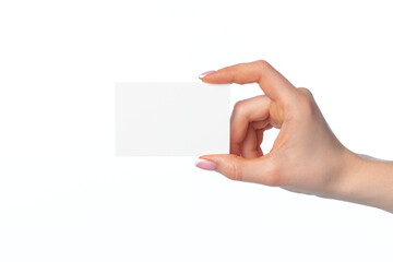 Obraz premium Female hand with blank white business card isolated on white