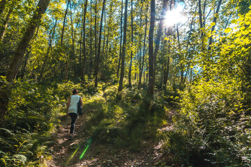 Obraz premium Young girl visiting the Listorreta Natural Park in the town of Errenteria in the Peñas de Aya or Aiako Harria Park in summer. Gipuzkoa, Basque Country