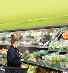 Woman buying vegetables at the market	
