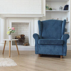 Navy blue classic armchair and flower vase on modern white wooden table