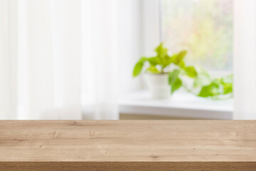Wood texture table on defocused summer window sill background.