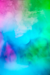 Obraz na płótnie Canvas Abstract colorful, multicolored smoke spreading, bright background for advertising or design, wallpaper for gadget. Neon lighted smoke texture, blowing clouds. Modern designed.