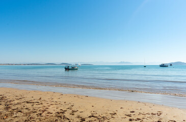 Fototapeta na wymiar tropical beach landscape with fishing boats in brazil